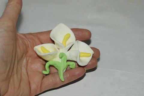 finished clay flowers to attach to cannister